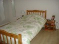 Lit 1 personne 90*190 en pin naturel + 2 tables de nuit + sommier + matelas. Le tout en très bon état.